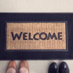A welcome doormat showing hospitality to those entering our home.