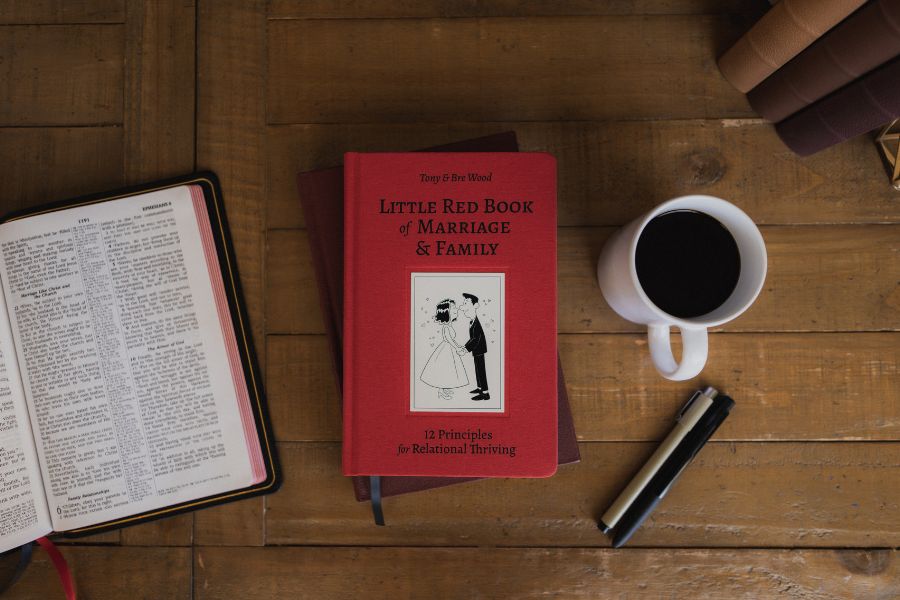 The Little Red book of marriage with bible and coffee